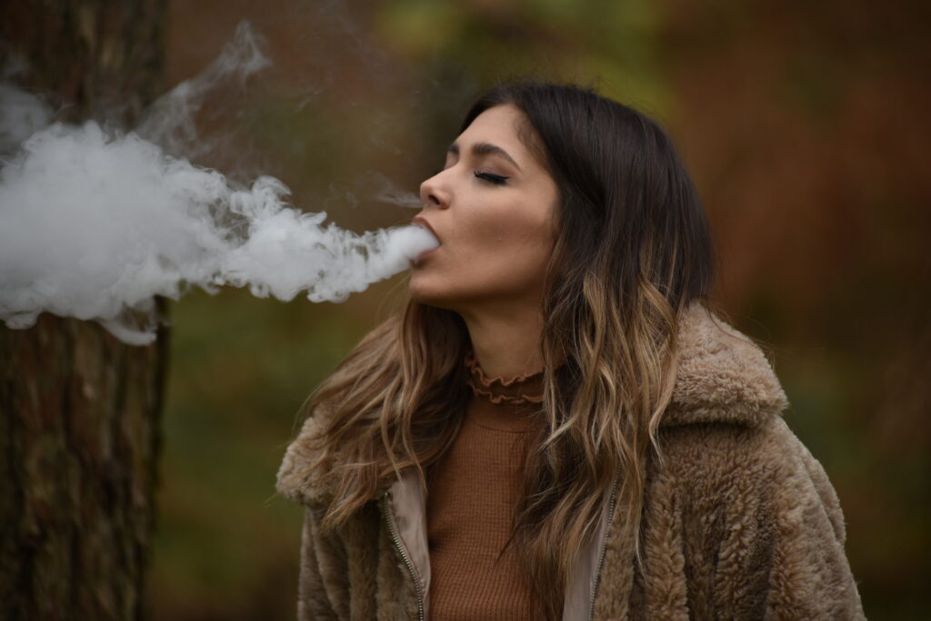 A women smoking a vape